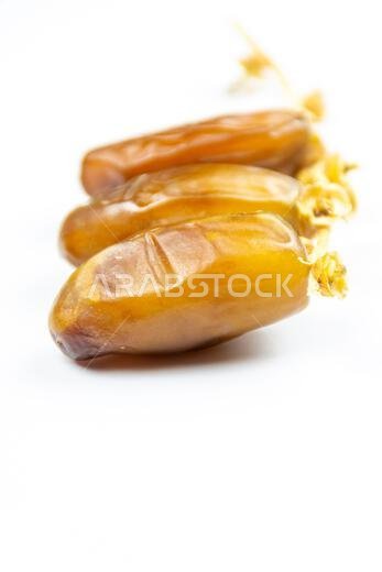 Close-up of Algerian royal dates on a white background. Ramadan concept.