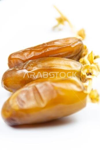 Close-up of Algerian royal dates on a white background. Ramadan concept.