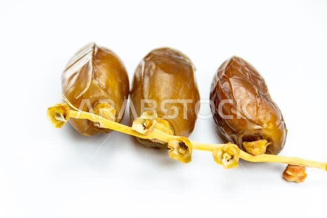 Close-up of Algerian royal dates on a white background. Ramadan concept.