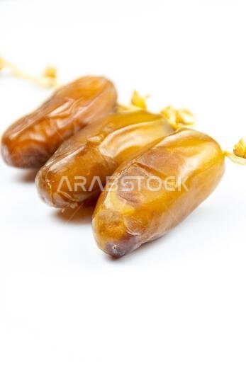 Close-up of Algerian royal dates on a white background. Ramadan concept.