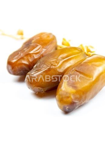 Close-up of Algerian royal dates on a white background. Ramadan concept.