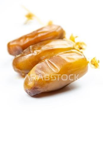 Close-up of Algerian royal dates on a white background. Ramadan concept.