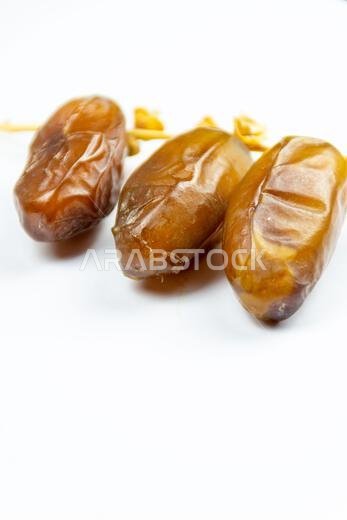 Close-up of Algerian royal dates on a white background. Ramadan concept.