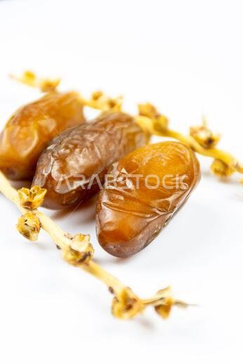 Close-up of Algerian royal dates on a white background. Ramadan concept.