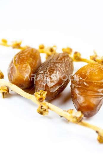 Close-up of Algerian royal dates on a white background. Ramadan concept.