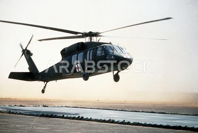A UH-60 Black Hawk (Blackhawk) helicopter prepares to touch down for refueling during Operation Desert Storm. Subject Operation/Series: DESERT STORM Country: Saudi Arabia(SAU)
