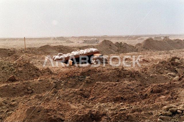 Seabees from Naval Mobile Construction Battalion 5 (NMCB-5) man a fighting position during a camp defense drill. NMCB-5 is in northern Saudi Arabia to provide engineering support for coalition forces during Operation Desert Storm. Subject Operation/Series: DESERT STORM Country: Saudi Arabia (SAU)