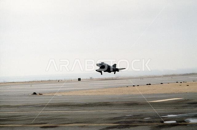 A 35th Tactical Fighter Wing F-4G Wild Weasel aircraft takes off on its return flight to the United States in the aftermath of Operation Desert Storm.. Subject Operation/Series: DESERT STORM Country: Saudi Arabia(SAU)