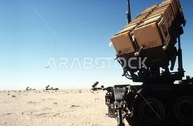 MIM-104 Patriot tactical air defense missile launchers of Battery E, 3rd Battalion, 43rd Air Defense Artillery, line the desert horizon during Operation DESERT SHIELD. Subject Operation/Series: DESERT SHIELD Country: Saudi Arabia(SAU) MIM-104 Patriot tactical air defense missile launchers of Battery E, 3rd Battalion, 43rd Air Defense Artillery, line the desert horizon during Operation DESERT SHIELD. Subject Operation/Series: DESERT SHIELD Country: Saudi Arabia(SAU)