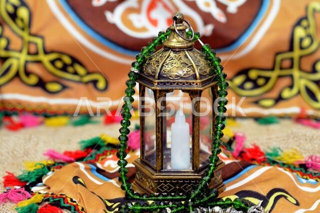 Ramadan Lantern lamp or Fanous Ramadan on a Ramadan background as a festive celebration of the Islamic fasting days in Arabian Islamic countries, reli Ramadan Lantern lamp or Fanous Ramadan on a Ramadan background as a festive celebration of the Islamic fasting days in Arabian Islamic countries, reli