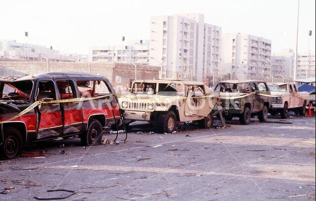 Some of the bomb damaged vehicles, High-Mobility Multipurpose Wheeled Vehicles (HMMWV), van and trucks, lined up near the Khobar Towers complex. The explosion of a fuel truck set off by terrorists at 2:55 p.m. EDT, Tuesday, June 25, 1996, outside the northern fence of the Khobar Towers complex near King Abdul Aziz Air Base, killed 19 and injured over 260. The facility housed U.S. service members and served as the headquarters for the 4404th Wing (Provisional), Southwest Asia. Subject Operation/S Some of the bomb damaged vehicles, High-Mobility Multipurpose Wheeled Vehicles (HMMWV), van and trucks, lined up near the Khobar Towers complex. The explosion of a fuel truck set off by terrorists at 2:55 p.m. EDT, Tuesday, June 25, 1996, outside the northern fence of the Khobar Towers complex near King Abdul Aziz Air Base, killed 19 and injured over 260. The facility housed U.S. service members and served as the headquarters for the 4404th Wing (Provisional), Southwest Asia. Subject Operation/S