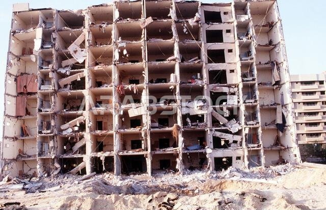 An overall view of the north side of the building that was severely bomb damaged in the Khobar Towers complex. The explosion of a fuel truck set off by terrorists at 2:55 p.m. EDT, Tuesday, June 25, 1996, outside the northern fence of the Khobar Towers complex near King Abdul Aziz Air Base, killed 19 and injured over 260. The facility housed U.S. service members and served as the headquarters for the 4404th Wing (Provisional), Southwest Asia. Subject Operation/Series: SOUTHERN WATCH Base: Dhahra