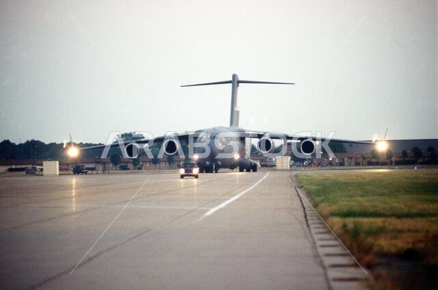 A front view of one of eight C-17 Globemasters from the 437th Airlift Wing as it taxis down the 1ST Fighter Wing runway to deliver personnel and cargo to Saudi Arabia. Subject Operation/Series: VIGILANT SENTINEL Base: Langley Air Force Base State: Virginia (VA) Country: United States Of America (USA)
