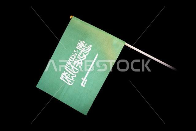 the national flag of saudi arabia on a black background.