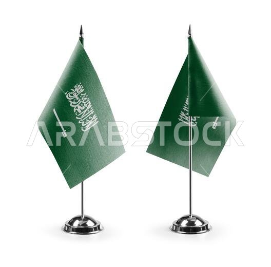 Small national flags of the Saudi Arabia on a white background.
