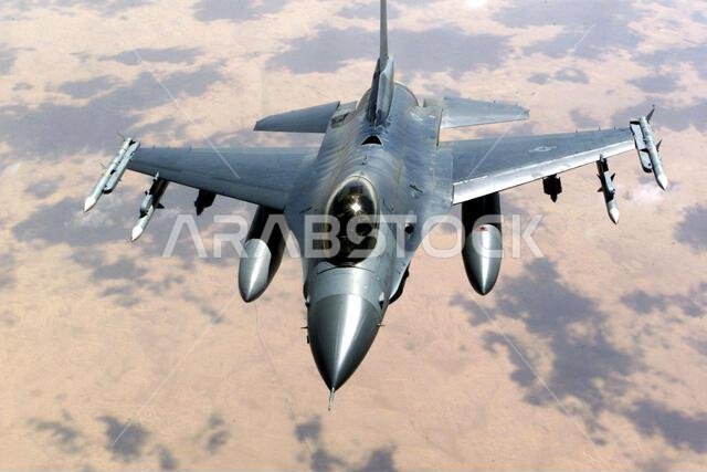 An F-15 Eagle aircraft over Saudi Arabia in support of Operation SOUTHERN WATCH. The F-15 is armed with AIM 7 Sparrow missiles and AIM 120 advanced medium-range air-to-air missiles (AMRAAM) and is part of the coalition forces of the 363rd Air Expeditionary Wing who enforce the no-fly and no-drive zone in Southern Iraq to protect and defend against Iraqi aggression. Subject Operation/Series: SOUTHERN WATCH Country: Unknown