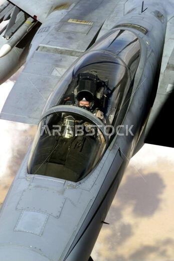 An F-15 Eagle aircraft refuels from a KC-135 Stratotanker (not shown) over Saudi Arabia in support of Operation SOUTHERN WATCH. The F-15 is part of the coalition forces of the 363rd Air Expeditionary Wing who enforce the no-fly and no-drive zone in Southern Iraq to protect and defend against Iraqi aggression. Subject Operation/Series: SOUTHERN WATCH Country: Unknown