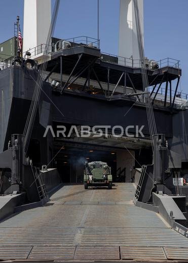U.S. Marines with Combat Logistics Regiment 1, 1st Marine Logistics Group, load tactical vehicles onto the USNS Seay (T-AKR-302) during exercise Native Fury 22 at Yanbu Commercial Port, Kingdom of Saudi Arabia, Aug. 27, 2022. The focus of Native Fury 22 is to execute a Maritime Prepositioning Force offload in a Western port of Saudi Arabia. MPF operations are the rapid deployment and assembly of a U.S. Marine Air Ground Task Force in a secure using inter-theater airlift and forward-deployed mari