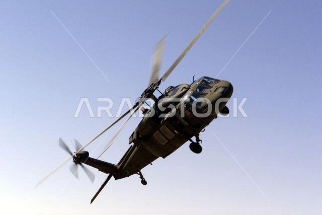 A UH-60 Blackhawk helicopter from the 571st medical company, Fort Carson, Colorado, performs a fly by near Prince Sultan Air Base, Saudi Arabia. Members of the 571st medical company are a part of the coalition forces of the 363rd Air Expeditionary Wing, Prince Sultan Air Base, Saudi Arabia, that enforces the no-fly and no-drive zone in Southern Iraq to protect and defend against Iraqi aggression in support of Operation SOUTHERN WATCH. Subject Operation/Series: SOUTHERN WATCH Base: Prince Sultan 