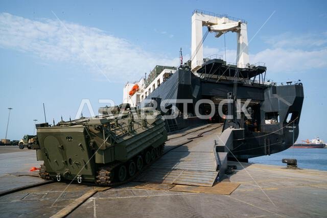 U.S. Marines assigned to Combat Logistics Regiment 1, 1st Marine Logistics Group, load an A1 Assault Amphibious Vehicle (AAV-P7) onto the USNS Seay (T-AKR-302) during exercise Native Fury 22 at the Yanbu Commercial Port, Kingdom of Saudi Arabia, Aug. 29, 2022. The focus of Native Fury 22 is to execute a Maritime Prepositioning Force (MPF) in the U.S. Central Command area of responsibility in support of regional security, crisis response, and contingency operations. IMEF,KSA,MARCENT,NATIVEFURY22, U.S. Marines assigned to Combat Logistics Regiment 1, 1st Marine Logistics Group, load an A1 Assault Amphibious Vehicle (AAV-P7) onto the USNS Seay (T-AKR-302) during exercise Native Fury 22 at the Yanbu Commercial Port, Kingdom of Saudi Arabia, Aug. 29, 2022. The focus of Native Fury 22 is to execute a Maritime Prepositioning Force (MPF) in the U.S. Central Command area of responsibility in support of regional security, crisis response, and contingency operations. IMEF,KSA,MARCENT,NATIVEFURY22,