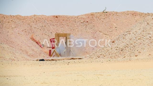 U.S. Air Force Explosive Ordnance Disposal specialists assigned to the 378th Expeditionary Civil Engineer Squadron, detonate a breaching charge at Prince Sultan Air Base, Kingdom of Saudi Arabia, Aug. 18, 2022. Brig. Gen. William Betts, the commander of the 378th Air Expeditionary Wing, and other 378th AEW leadership visited the EOD team to learn about their capabilities and recognize their outstanding performers. 378th Air Expeditionary Wing,378th Expeditionary Civil Engineer Squadron,AFCENT,Ki