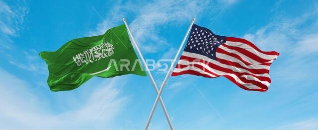 two crossed flags United States of America and Saudi Arabia waving in wind at cloudy sky. Concept of relationship, dialog, travelling between two coun