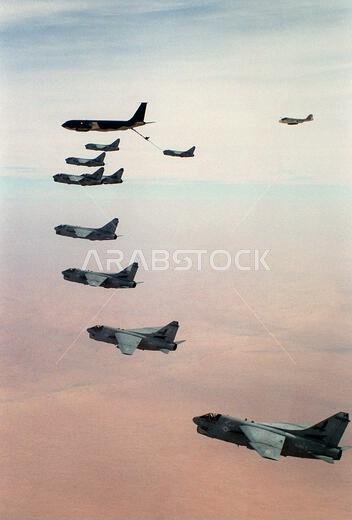 A-7E Corsair aircraft from Attack Squadron 72 (VA-72), foreground, and Attack Squadron 46 (VA-46) conduct aerial refueling with an Air Force KC-135 Stratotanker aircraft. An Attack Squadron 75 (VA-75) KA-6D Intruder aircraft is at upper right. The Navy aircraft are deployed aboard the aircraft carrier USS JOHN F. KENNEDY (CV-67), which is on station in the Red Sea in support of Operation Desert Shield. Subject Operation/Series: DESERT SHIELD Country: Saudi Arabia (SAU)