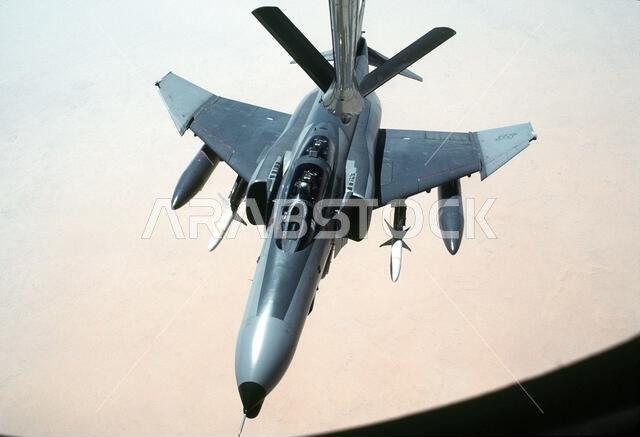 A 35th Tactical Fighter Wing F-4G Phantom II aircraft approaches the refueling boom of a KC-135 Stratotanker aircraft while on a training flight during Operation Desert Shield. The aircraft is carrying external fuel tanks on its outboard wing pylons and AGM-88A HARM high-speed anti-radiation missiles on its inboard wing pylons. Subject Operation/Series: DESERT SHIELD Country: Saudi Arabia (SAU) A 35th Tactical Fighter Wing F-4G Phantom II aircraft approaches the refueling boom of a KC-135 Stratotanker aircraft while on a training flight during Operation Desert Shield. The aircraft is carrying external fuel tanks on its outboard wing pylons and AGM-88A HARM high-speed anti-radiation missiles on its inboard wing pylons. Subject Operation/Series: DESERT SHIELD Country: Saudi Arabia (SAU)