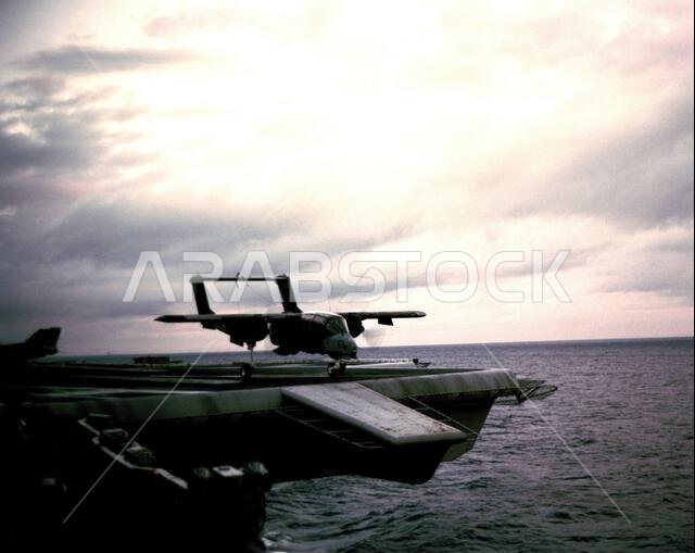 A Marine Observation Squadron 1 (VMO-1) OV-10 Bronco aircraft takes off from the flight deck of the aircraft carrier USS AMERICA (CV 66) as the ship passes Rota, Spain, while en route to the Persian Gulf region for Operation Desert Shield. The six VMO-1 aircraft that were carried across the Atlantic Ocean aboard the America will stop in Rota before continuing on to Saudi Arabia.. Subject Operation/Series: DESERT SHIELD Country: Mediterranean Sea(MED) A Marine Observation Squadron 1 (VMO-1) OV-10 Bronco aircraft takes off from the flight deck of the aircraft carrier USS AMERICA (CV 66) as the ship passes Rota, Spain, while en route to the Persian Gulf region for Operation Desert Shield. The six VMO-1 aircraft that were carried across the Atlantic Ocean aboard the America will stop in Rota before continuing on to Saudi Arabia.. Subject Operation/Series: DESERT SHIELD Country: Mediterranean Sea(MED)