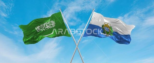 two crossed flags San Marino and Saudi Arabia waving in wind at cloudy sky. Concept of relationship, dialog, travelling between two countries. 3d illu