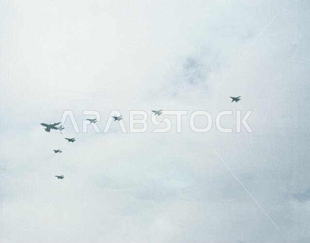 Six F-14A Tomcat and an A-6E Intruder aircraft from Carrier Air Wing 1 (CVW-1) conduct an in-flight refueling with an Air Force KC-135 Stratotanker aircraft while en route to their target during Operation Desert Storm. CVW-1 is deployed aboard the aircraft carrier USS AMERICA (CV 66).. Subject Operation/Series: DESERT STORM Country: Saudi Arabia(SAU) Six F-14A Tomcat and an A-6E Intruder aircraft from Carrier Air Wing 1 (CVW-1) conduct an in-flight refueling with an Air Force KC-135 Stratotanker aircraft while en route to their target during Operation Desert Storm. CVW-1 is deployed aboard the aircraft carrier USS AMERICA (CV 66).. Subject Operation/Series: DESERT STORM Country: Saudi Arabia(SAU)