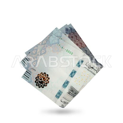 3d rendering of Folded Saudi Arabian riyal notes isolated on white background.