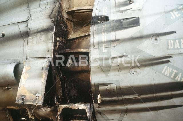 The engine housing of an A-6E Intruder attack aircraft from Attack Squadron 35 (VA-35), deployed from the aircraft carrier USS SARATOGA (CV-60), shows battle damage from a mission at the start of Operation Desert Storm.. Subject Operation/Series: DESERT STORM Country: Saudi Arabia(SAU)