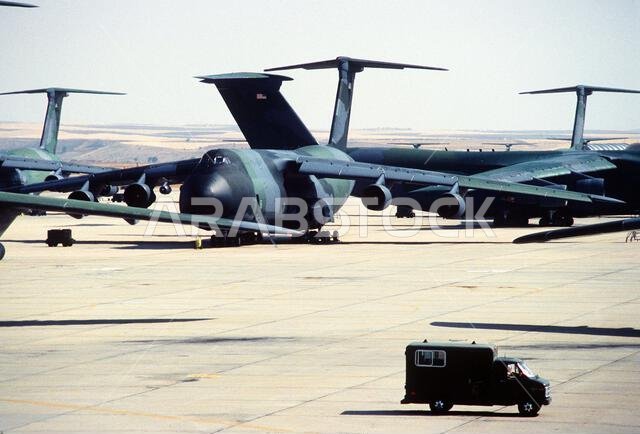 C-5 Galaxy aircraft stand on the flight line in support of Operation Desert Shield. Subject Operation/Series: DESERT SHIELD Country: Saudi Arabia (SAU)