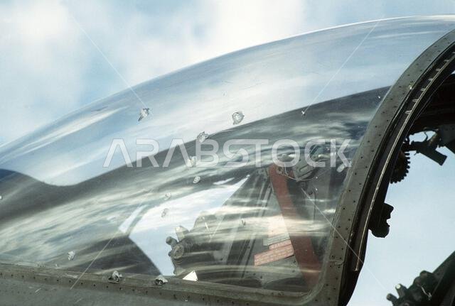 The canopy of an A-6E Intruder attack aircraft from Attack Squadron 35 (VA-35), deployed from the aircraft carrier USS SARATOGA (CV-60), shows battle damage from a mission at the start of Operation Desert Storm.. Subject Operation/Series: DESERT STORM Base: USS Saratoga(CV 60) Country: Saudi Arabia(SAU) The canopy of an A-6E Intruder attack aircraft from Attack Squadron 35 (VA-35), deployed from the aircraft carrier USS SARATOGA (CV-60), shows battle damage from a mission at the start of Operation Desert Storm.. Subject Operation/Series: DESERT STORM Base: USS Saratoga(CV 60) Country: Saudi Arabia(SAU)