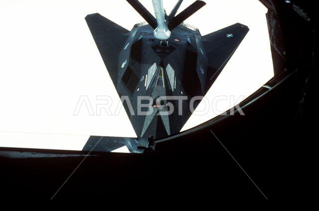 A 37th Tactical Fighter Wing (37th TFW) F-117A aircraft refuels in midair while en route to Saudi Arabia for Operation Desert Shield. Subject Operation/Series: DESERT SHIELD Country: Unknown