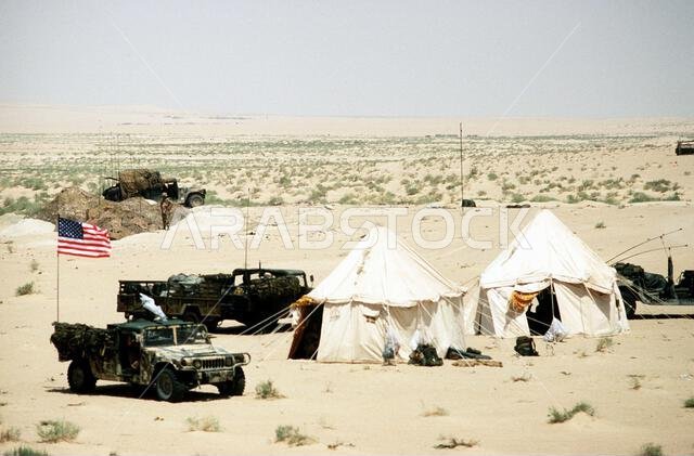 M998 High-Mobility Multipurpose Wheeled Vehicles (HMMWV) are parked at an outpost during Operation Desert Shield. Subject Operation/Series: DESERT SHIELD Country: Saudi Arabia (SAU)