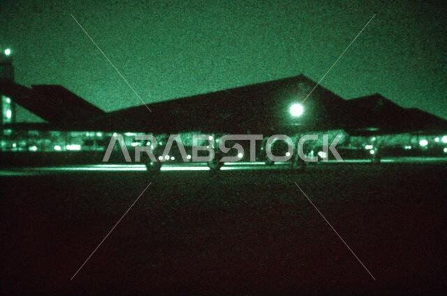 As seen through a night vision lens, three F-117A aircraft from the 37th Tactical Fighter Wing (37th TFW) prepare to taxi onto the flight line during Operation Desert Shield. Subject Operation/Series: DESERT SHIELD Country: Saudi Arabia (SAU)