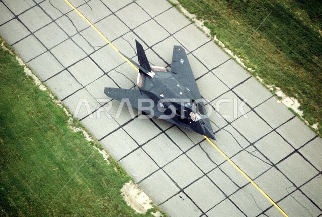 An F-117A aircraft from the 37th Tactical Fighter Wing (37th TFW) rolls down a taxiway. The 37th TFW is preparing to deploy to Saudi Arabia for Operation Desert Shield. Subject Operation/Series: DESERT SHIELD Base: Langley Air Force Base State: Virginia (VA) Country: United States Of America (USA) An F-117A aircraft from the 37th Tactical Fighter Wing (37th TFW) rolls down a taxiway. The 37th TFW is preparing to deploy to Saudi Arabia for Operation Desert Shield. Subject Operation/Series: DESERT SHIELD Base: Langley Air Force Base State: Virginia (VA) Country: United States Of America (USA)