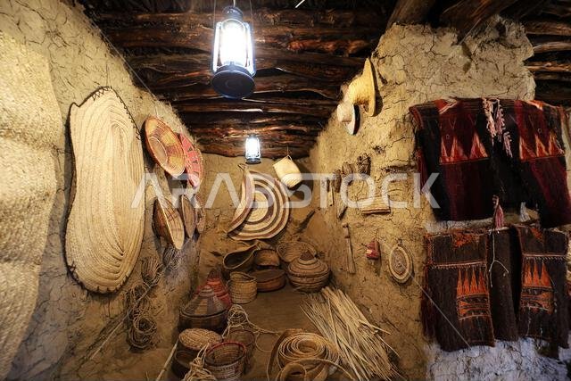 old traditional crafts in old arab mud house interior- Al Malad heritage Museum - Al Baha , Saudi Arabia old traditional crafts in old arab mud house interior- Al Malad heritage Museum - Al Baha , Saudi Arabia