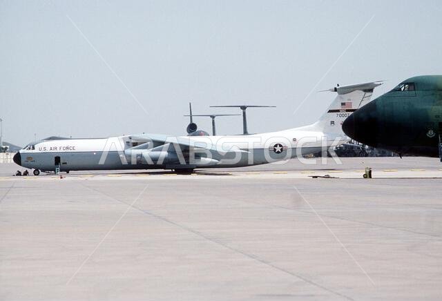 A Military Airlift Command C-141B Starlifter aircraft is parked on the flight line during Operation Desert Shield. Subject Operation/Series: DESERT SHIELD Country: Saudi Arabia (SAU)