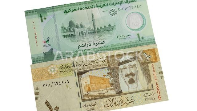 UAE and KSA new 10 dirham and riyal bank notes isolated on white background