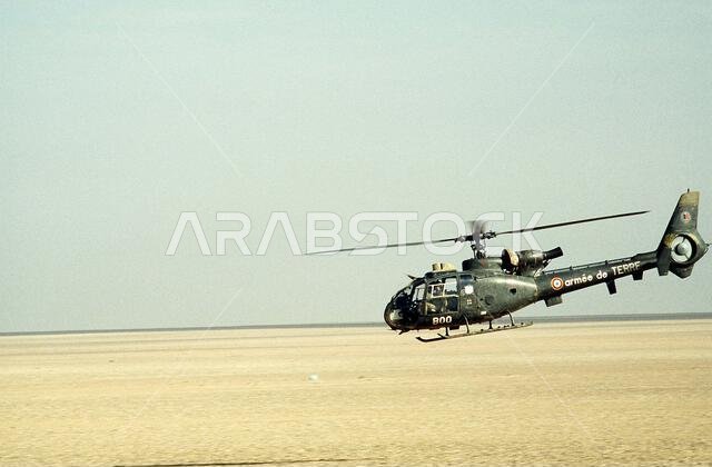 A French Aerospatiale SA-342 Gazelle helicopter prepares to land in the desert during Operation Desert Shield.. Subject Operation/Series: DESERT SHIELD Country: Saudi Arabia(SAU)