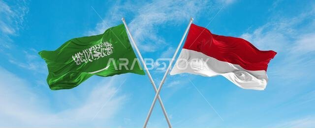 two crossed flags Monaco and Saudi Arabia waving in wind at cloudy sky. Concept of relationship, dialog, travelling between two countries. 3d illustra