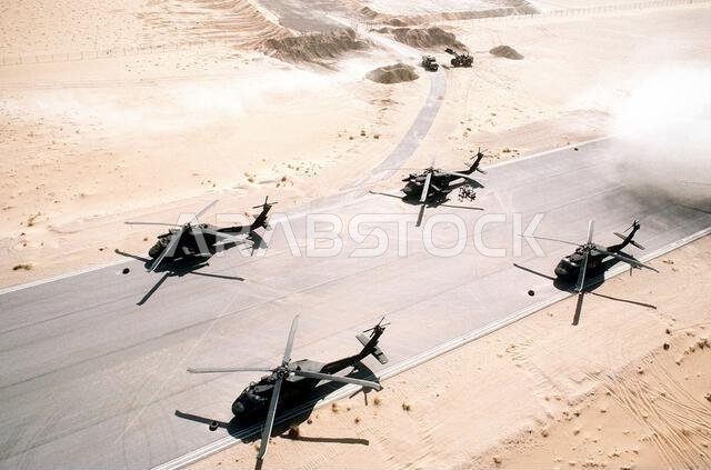 UH-60 Blackhawk helicopters of the 82nd Aviation Brigade stand on a runway during Operation Desert Shield.. Subject Operation/Series: DESERT SHIELD Country: Saudi Arabia(SAU)