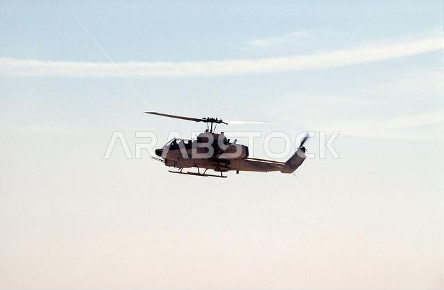 A AH-1W Sea Cobra helicopter of Marine Utility/Attack Squadron 369 (HMLA-369) flies over the desert during Exercise Imminent Thunder, part of Operation Desert Shield.. Subject Operation/Series: IMMINENT THUNDERDESERT SHIELD Country: Saudi Arabia(SAU) A AH-1W Sea Cobra helicopter of Marine Utility/Attack Squadron 369 (HMLA-369) flies over the desert during Exercise Imminent Thunder, part of Operation Desert Shield.. Subject Operation/Series: IMMINENT THUNDERDESERT SHIELD Country: Saudi Arabia(SAU)