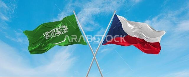 two crossed flags Czech Republic and Saudi Arabia waving in wind at cloudy sky. Concept of relationship, dialog, travelling between two countries. 3d
