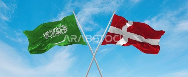 two crossed flags denmark and Saudi Arabia waving in wind at cloudy sky. Concept of relationship, dialog, travelling between two countries. 3d illustr