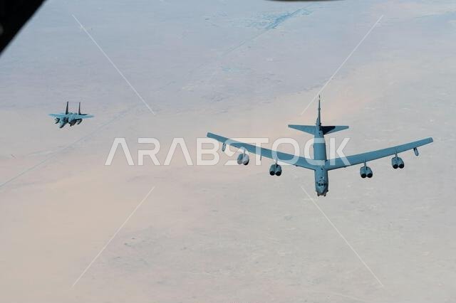 A Royal Saudi Air Force F-15 flies alongside a U.S. Air Force B-52H Stratofortress above the Kingdom of Saudi Arabia, March 29, 2022. The presence of the B-52H showcases U.S. Central Command's ability to deliver combat airpower at a moment's notice, as well as its commitment to partners and regional security. A Royal Saudi Air Force F-15 flies alongside a U.S. Air Force B-52H Stratofortress above the Kingdom of Saudi Arabia, March 29, 2022. The presence of the B-52H showcases U.S. Central Command's ability to deliver combat airpower at a moment's notice, as well as its commitment to partners and regional security.