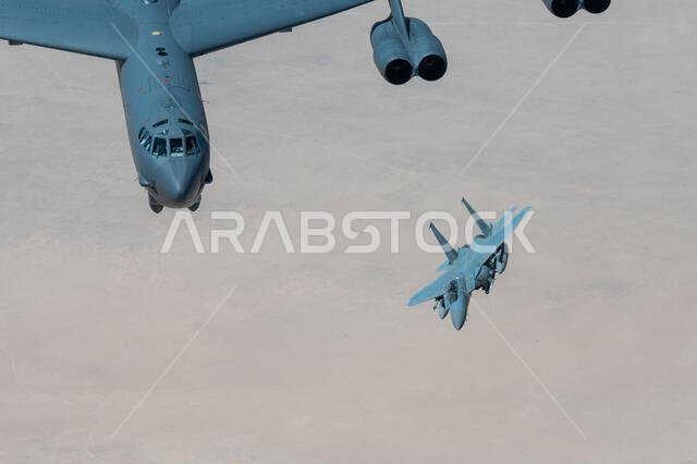 A Royal Saudi Air Force F-15 flies with a U.S. Air Force B-52H Stratofortress above the Kingdom of Saudi Arabia, March 29, 2022. The bomber’s flight originated at Royal Air Force Fairford, England, and flew over the East Mediterranean, Arabian Peninsula, and Red Sea before departing the region.